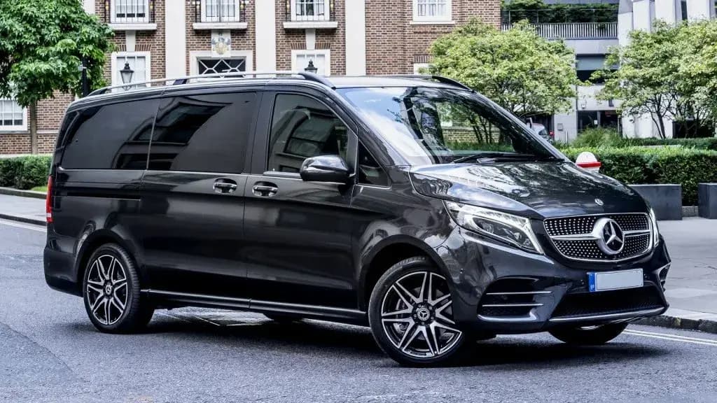 Premium black Mercedes-Benz V-Class chauffeur van for long-distance transfers